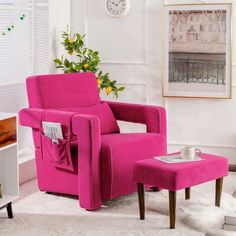 a pink chair and ottoman in a living room