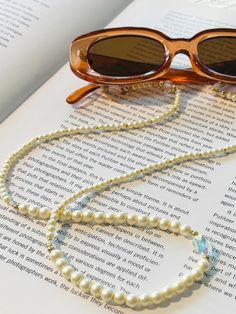 Handmade beaded eyeglass chain; The perfect way to add a touch of 'beach vibes' to your everyday look.  With its one-of-a-kind design, each chain is carefully crafted using high-quality gemstones, glass beads, pearls, and crystals, creating a chic and vibrant accessory that's as unique as you are.  Lightweight and comfortable, Whether you're lounging at the beach or out and about, this eye-catching piece will keep your glasses handy and elevate your style. Perfect for gifting or treating yourself, this beachy patchouli piece, combines style with practicality, adding a pop of color and elegance to any outfit.  Shop now and add a little coastal flair to your accessory collection! Pearl Glasses Chain, Pearl Glasses, Beaded Eyeglass Chain, Beaded Glasses, Sunglasses Necklace, Glasses Chains, Glasses Holder, Eyeglass Chain, Outfit Shop