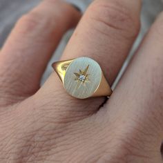 Our solid gold starburst signet ring features a cosmic star set with a sparkling diamond. Choose from 14k, 18k yellow, rose, white gold or platinum. Prefer a colored gemstone in place of the diamond? Just leave us a note at checkout. This ring is a lovely addition to your celestial fine jewelry, and makes a meaningful, timeless (and cool!) gift for your loved ones this holiday season. Details: - Made at our family-run studio in NYC. - Solid 14k, 18k yellow, rose, white gold or platinum -- choose Star-shaped Diamond Ring With Single Diamond For Anniversary, Celestial Rose Gold Diamond Ring In 14k Gold, Celestial Style 14k Rose Gold Diamond Ring, Classic Yellow Gold Star-shaped Diamond Ring, 14k White Gold Signet Ring With Single Cut Diamonds, Celestial Style Single Diamond Ring, Celestial Style Diamond Signet Ring In Yellow Gold, Celestial Signet Ring With Polished Finish For Anniversary, Celestial Oval 14k Gold Signet Ring