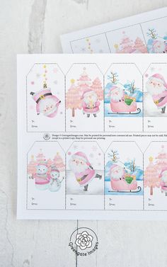 some pink and white stickers with santa clause on them