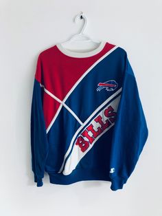 "bills starter polyester sweatshirt  Size: m pit to pit: 22\" neck to bottom: 26\" collar to cuff: 29\"" Bills Sweatshirt, Blue Sweatshirt With Team Name For Streetwear, Blue Streetwear Sweatshirt With Team Name, Vintage Buffalo Bills, Throwback Blue Sweatshirt For Game Day, Blue Throwback Sweatshirt For Game Day, Throwback Team Logo Long Sleeve Sweatshirt, Winter Team Logo Long Sleeve Sweatshirt, Throwback Sweatshirt With Ribbed Cuffs For Game Day