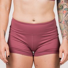 These Booty Shorts are all the rage! Spandex athletic shorts that move with you - not against you. Our Rusty Shorts, a pair of our classic solid color booty shorts, are a must-have for every woman that is serious about her fitness journey. Savage Classic Booty Shorts are custom-made with a perfect blend of nylon and spandex. These dusty rose shorts feature 4-way stretch performance fabrics. They're soft, comfortable, squat proof, and stay in place so you can achieve full range of motion in and o Solid Swimwear With Built-in Shorts For Training, Mid-thigh Length Boxer Briefs With Built-in Shorts, Gym Shorts With Contoured Waistband, Gym High-waisted Shorts With Contoured Waistband, Solid Mid-thigh Athletic Shorts For Yoga, Workout Boxer Briefs With Built-in Shorts, Sports Biker Shorts With Built-in Shorts, Sports Biker Shorts With Short Inseam, Athleisure Shorts With Elastic Waistband For Cheerleading