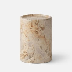 a marble vase sitting on top of a white table