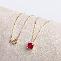 "Garnet Stone; The representative of passion, true friendship, loyalty, success and consistency.  Our single diamond squar ruby necklace is a jewel that you can use daily and on special occasions with its minimalist design. It is a nice gift for yourself and your loved ones. Our necklace will add novelty and elegance to your style. The birthstone of those born in January is garnet. You are welcome to our store for all our products; https://www.etsy.com/shop/StyleDiamond?ref=seller-platform-mcnav Ruby Locket, Gold Chain For Women, Chirstmas Gift, Solid Gold Necklace, Chain For Women, Ruby Necklace, Birthstone Pendant, True Friendship, Ruby Stone