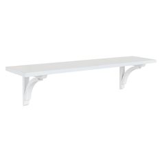 a white shelf sitting on top of a wall