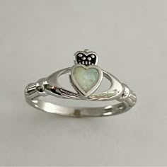 Sterling Silver Opal Heart Claddagh Ring. Heart Ring, White Opal Ring, Silver Ring, Irish Ring, Boho Ring, Friendship Ring, Can Be Worn Multiple Fingers, Midi Ring, Toe Ring. A Claddagh Ring Comprises Three Symbolic Elements, And Each Has Its Own Meaning A Crowned Heart Held By Two Hands - Symbolically, The Heart Represents Love, The Crown Denotes Loyalty, And The Hands Are A Sign Of Friendship Perfect Gift Idea For Any Occasion: Birthday, Anniversary, Engagement, Graduation, Bridesmaid, Mother’ Meaning Of Claddagh Ring, Irish Cladaggah Ring, Claddaugh Engagement Rings, Irish Friendship Ring, Irish Claddagh Wedding Rings, Cladaggah Ring, White Heart-shaped Birthstone Ring, White Heart Cut Ring With Birthstone, Claddagh Engagement Ring