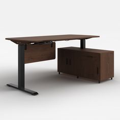 an office desk with a cabinet underneath it