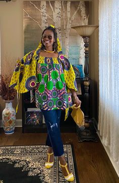 "Unique top made from African wax prints. Off the shoulders with long flamboyant sleeves and fun long bow ties. This top can be worn on or off-shoulder. Check out the cute shirttail cut. To purchase, select size, place item in the cart, and checkout. Measurement Guide:(Inches) US \"2\" /UK \"6\" XXS Bust:31 Hips: 34 US \"4\"/ UK \"8\" XS - Bust:32 Hips: 36 US \"6\"/ UK \"10\" S - Bust:34 Hips: 38 US \"8\"/ UK \"12\" M - Bust:36 Hips: 40 US \"10\"/ UK \"14\" L- Bust: 38 Hip: 42 US \"12/\" UK \"16 African Tops For Women Ankara, Ankara Blouses For Women, Kitenge Tops, Ankara Blouses, African Print Top, African Tops For Women, Ankara Blouse, African Blouses, African Tops