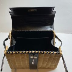 Elevate your style with the Willa Woven Black Straw Hand Bag, a timeless accessory that embodies effortless elegance and sophistication. Crafted for the modern woman, this exquisite bag promises to be your go-to companion, inspiring confidence and turning heads wherever you go. 11" x 3.5" x 9" Woven Rattan. Vegan leather trim Includes long strap Pair it with one of our Ashley acrylic convertible straps for a unique look! Designer Rectangular Straw Bag With Top Carry Handle, Designer Black Rectangular Straw Bag, Designer Black Straw Bag For Daily Use, Luxury Rectangular Straw Bag With Detachable Strap, Designer Top Handle Straw Bag With Detachable Strap, Designer Rectangular Shoulder Bag With Adjustable Strap, Designer Box Bag With Adjustable Strap For Everyday Use, Chic Rectangular Straw Bag With Detachable Strap, Designer Straw Tote Bag With Adjustable Strap