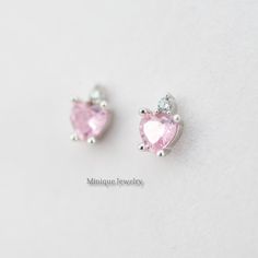 The pink color is vibrant and sweeps across the stone. The stone is a brilliant-cut style of tourmaline showing off the depths of pink that is completely mesmerizing and a tiny CZ on top of the heart-shaped Pink Simulated Tourmaline. 🎀 Material: 0.925 Sterling Silver 🎀 Finishing: High Polish, Rhodium plated (Anti-Tarnish) 🎀 Width: 5 mm 🎀Height: 6 mm 🎀 Shape: Heart 🎀 Closure: Push Back 🎀 Sold as a PAIR ✈️READY TO SHIP the next day! 🎀 Please note that pictures are magnified to show the det Heart-shaped White Gold Gemstone Earrings, White Gold Heart Gemstone Earrings, White Gold Heart Earrings With Gemstones, White Gold Heart Shaped Gemstone Earrings, Elegant Pink Heart Cut Earrings, Sterling Silver Heart Earrings With Gemstones, Pink Round Heart Earrings, Pink Heart Cut Wedding Earrings, Pink Heart-shaped Gemstone Earrings