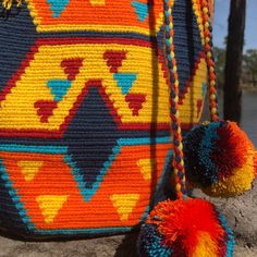 Crochet bag, authentic Wayuú Mochila Bag , Hand-made Wayuu Bag,Premium quality, bucket bag, drawstring bag, Large Size. -Original handmade Wayuu mochila bag that will go with any outfit. -The stunning, one-of-a-kind, 100% handmade crossbody has been carefully crocheted. This is an unique high-quality crochet bag which contain a beautiful color combination and tribal patterns -This beautiful Wayuu bag that was carefully crafted using a single thread technique, which is the most traditional croche Multicolor Bucket Crochet Bag For Festivals, Multicolor Crochet Bucket Bag For Festivals, Multicolor Bucket Bag For Festivals, Festival Multicolor Bucket Bag, Multicolor Festival Bucket Bag, Handmade Multicolor Pouch Bucket Bag, Traditional Bucket Bag For Festivals, Handmade Bucket Bag For Festivals, Bohemian Purse