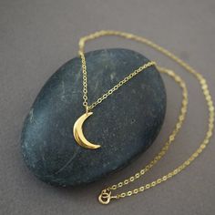 Crescent Moon Necklace Gold (284G) Celestial Style Necklace With Moon Charm, Celestial Moon-shaped Jewelry For Meditation, Celestial Moon Jewelry For Meditation, Spiritual Moon-shaped Everyday Jewelry, Sterling Silver Necklaces With Moon Charm For Meditation, Elegant Half Moon Charm Necklace For Gifts, Everyday Celestial Moon Necklace, Magical Moon Shaped Sterling Silver Necklace, Celestial Half Moon Jewelry Gift