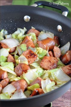 sausage and cabbage cooking in a skillet