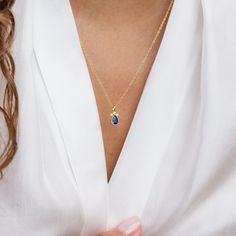 The Sapphire Teardrop Necklace is a beautiful choice for those looking for a timeless and meaningful accessory or a thoughtful gift for someone special. This particular necklace showcases a teardrop-shaped pendant adorned with a sapphire gemstone. Sapphire is the birthstone for the month of September, making it a meaningful gift for those born in that month or anyone who appreciates the beauty of sapphire. Material: High Quality Solid 925 Sterling Silver Finish: Sterling Silver ∙ 18K Gold Featur Elegant Teardrop Birthstone Drop Necklace, Sapphire Drop Necklaces For Gifts, Sapphire Drop Necklace For Gift, Sapphire Teardrop Pendant Necklace, Sapphire Teardrop Necklace For Gift, Sapphire Teardrop Pendant Jewelry, Sapphire Teardrop Pendant Necklace Gift, Teardrop Sapphire Birthstone Jewelry, Teardrop Birthstone Charm Necklace