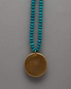 Long Turquoise Beaded Necklace About our locket The beauty of organic turquoise beads and the grace of a copper locket are combined in the Long Turquoise Beaded Necklace. The locket, which was carefully handmade with every detail in mind, has an electrogold coating that gives it a sophisticated appearance. The exquisite visual impression that is produced by the painstaking selection and stringing of each bead is enhanced by the tranquil beauty of the jade stones set inside the locket. In additio Turquoise Necklace With Gemstone Beads And Round Pendant, Turquoise Necklaces With Gemstone Beads, Turquoise Necklace With Round Gemstone Beads Pendant, Turquoise Necklace With Large Pendant And Round Beads, Turquoise Beaded Necklace With Round Pendant Gift, Turquoise Necklaces With Round Gemstone Pendant, Turquoise Beaded Necklace With Round Pendant, Turquoise Beaded Necklaces With Round Pendant, Artisan Turquoise Beaded Necklace With Large Pendant