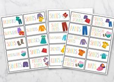 two printable clothes labels on a marble surface with the words shorts and shirts in different colors