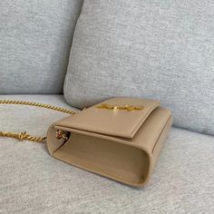 Size: 20cm*12.5cm*5cm It comes with Dust box, Care manual, Tag, and Paper bag. Beige Leather Satchel, High-end Beige Bag For Gift, High-end Beige Box Bag For Daily Use, Designer Beige Rectangular Case Bag, Luxury Tan Rectangular Shoulder Bag, Luxury Beige Rectangular Bag, Luxury Beige Satchel For Gift, Luxury Beige Satchel Perfect For Gift, Luxury Beige Satchel As Gift