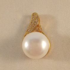 Classic Pear-shaped White Jewelry, Classic White Pear-shaped Jewelry, Fine Jewelry With White Pearl Charm, Fine Jewelry White Pearl Charm, White Pearl Charm Fine Jewelry, Fine White Jewelry With Pearl Charm, Pearl White Pendant Fine Jewelry, Exquisite White Jewelry With Pearl Charm, Classic White Pearl Charm Jewelry