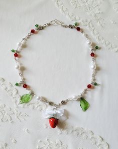 Strawberry Necklace is made with handmade polymer strawberry charms, acrylic leaf charms, glass beads, faux pearls, and silver plated copper wire.  Everything is handmade by me ♡ Feel free to send me a message if you have any questions or want custom sizing. Polymer Strawberry, Leaf Necklace Diy, Strawberry Necklace, Strawberry Charm, Hippie Aesthetic, Y2k Necklace, Gifts For My Girlfriend, Bee Necklace, Necklace Diy