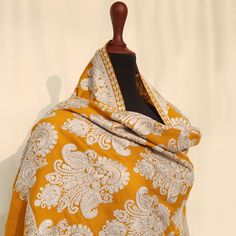 Mustard Embroidered Kashmiri pashmina kashmiri wool shawl with vibrant paisley embroidered motifs across the entire shawl. Embellished with regal embroidery. Perfect for formal occasions to add a pop of color to your outfits. These medium-length shawls are the perfect length to be styled with both eastern and western outfits. Dazzle up your wardrobe with a uniquely crafted fully embroidery shawl. Product specifications: Base color: Mustard Material: 100% Pashmina wool Washing instructions: Hand wash in cold water Dimensions:200cm by 70cm Shipping details: The product will be delivered to you between 5-10 working days. 1-2 days processing time for all orders. Now offering free shipping to your doorstep! Festive Jacquard Fabric With Embroidery, Festive Embroidered Jacquard Fabric, Semi-stitched Pashmina Embroidered Dupatta, Embroidered Jamawar Shawl In Traditional Drape, Festive Pashmina Fabric With Zari Embroidery, Wedding Pashmina Fabric With Resham Embroidery, Wedding Embroidered Pashmina Fabric With Resham Embroidery, Embroidered Pashmina Shawl In Traditional Drape, Pashmina Shawl With Chikankari Embroidery