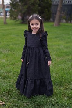 Kids Hijab Dress Almila Model Black Product Features   Fabric Feature: It is made of scalloped cotton fabric. It can be used in 4 seasons. Product Features : It is produced with Almila model festoon cotton fabric. The interior is fully lined with cotton. The front is threaded. Her shoulders are ruffled. It has a hidden zipper on the back. The sleeves are rubber. Note: This product is Black in color. If you are looking for a different color, visit our Etys store.  https://www.etsy.com/shop/Mevlan Kids Eid Dress, Kids New Model Dress, Solid Long Sleeve Dresses For Eid, Long Sleeve Solid Dress For Dress-up, Solid Color Long Sleeve Dress For Dress-up, Solid Long Sleeve Dress For Dress-up, Modest Black Dress For Eid, Black Modest Dress For Eid, Black Long Sleeve Dresses For Eid