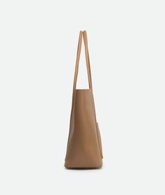 Meet the Velour Tote, your new go-to for effortless style. This genuine leather tote embodies simplicity and sophistication. Its spacious design is ideal for carrying all your essentials while exuding a timeless elegance that never goes out of fashion. Minimalist Hobo Tote Bag For On-the-go, Solid Color Tote Shoulder Bag With Smooth Grain, Smooth Grain Tote Shoulder Bag, Minimalist Rectangular Hobo Bag For Shopping, Rectangular Minimalist Hobo Bag For Shopping, Minimalist Shoulder Bag With Double Handle For Everyday Use, Minimalist Double Handle Shoulder Bag For Everyday Use, Beige Smooth Grain Hobo Bag For Everyday Use, Versatile Bucket Bag With Smooth Grain For Everyday Use