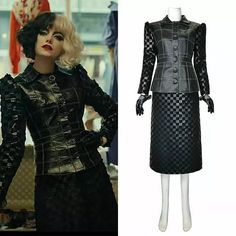 a mannequin dressed in black and silver leather with an embellished jacket