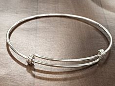 New for 2015. Now Available in Solid 925 Sterling Silver with Anti Tarnish Coating. The bracelet adjusts from 8 Inch to 9.50 Inch. The wire is 16 Gauge or 1.65mm. Make Personalized Bracelets and tell your story. Make special occasions memorable by having a keepsake piece of jewelry. Make your own celebrity style charm bracelet. Since it is sterling silver you do not have to worry about plating wearing off.. Buy one or stack up multiples, choice is yours. Need larger Quantities, please CONVO with Adjustable Silver Jubilee Bracelet Bangle, Adjustable Round Sterling Silver Bracelet For Gifts, Adjustable Round Sterling Silver Bracelet As Gift, Adjustable Sterling Silver Round Bracelet As A Gift, Adjustable Sterling Silver Bracelet As A Gift, Adjustable Sterling Silver Round Bangle, Adjustable Polished Bangle Jewelry, Adjustable Bangle With Sterling Silver Clasp, Adjustable Round Cuff Bracelet With Sterling Silver Clasp