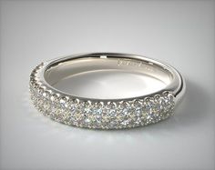 a white gold wedding band with rows of diamonds