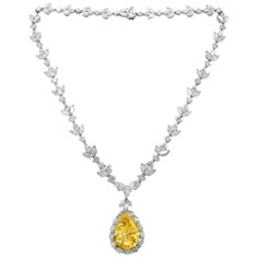 Platinum diamond necklace with GIA certified center 35.31 fancy intense vivd yellow vs2 pear shape, GIA#2145952743 set in platinum handmade necklace, features 47.00ct of outside diamonds D/E/F VVS-VS quality. Plus center 1.50ct pear e vs1 GIA#24155411814 Yellow Diamond Jewelry, Most Expensive Jewelry, Expensive Necklaces, Yellow Diamond Necklace, Drop Necklaces, Diamond Tattoos, Diamond Mangalsutra, Diamond Pendant Sets, Yellow Diamonds