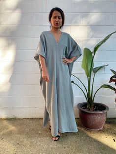 Embrace the gentle waves and sunny shores with our double gauze cotton kaftan. This versatile caftan falls gracefully between the knees or ankles, depending on the length you choose. It's the ultimate in loungewear for women - perfect as a beach dress or cover up. Crafted from light and airy double gauze cotton, it's your essential for a night on the town, a day by the sea, or just running errands. Summer Lounging Dress With Relaxed Fit, Relaxed Fit Summer Dress For Lounging, Relaxed Fit Summer Lounging Dress, Oversized Kaftan For Spring Loungewear, Spring Casual Unlined Kaftan, Spring Linen V-neck Kaftan, Relaxed Fit Kaftan For Loungewear In Spring, Casual V-neck Relaxed Fit Kaftan, Relaxed Fit V-neck Cover-up For Loungewear