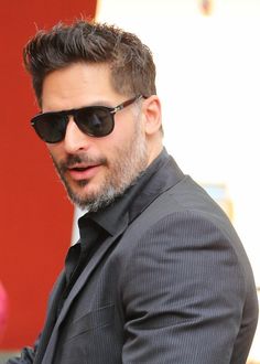 a man wearing sunglasses and a suit