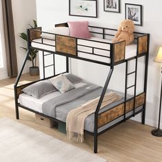 a bunk bed with two drawers underneath it and a teddy bear on the bottom shelf