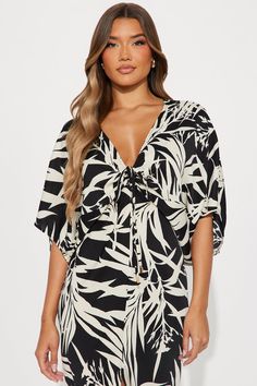 Available In Black/combo. Challis Midi Dress 3/4 Sleeves V-Neckline Drawstring Detail Ruched Length = 49" Disclaimer Pattern Placement May Vary Self: 100% Polyester Imported | Jamaican Breeze Midi Dress in Black size Medium by Fashion Nova Black V-neck Mini Dress For Vacation, Black V-neck Mini Dress In Viscose, V-neck Rayon Dress With Tie Waist, Black V-neck Mini Dress With Tie Waist, Beachwear V-neck Rayon Dress, Black V-neck Summer Mini Dress, Black Summer Tops With Tie Waist, Beach V-neck Mini Dress With Tie Waist, Beach Mini Dress With Tie Waist And V-neck