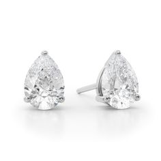 Perfect your everyday look with the timeless sparkle of these luxe pear-shaped diamond solitaire stud earrings in white gold. Crafted in 14K white gold Each earring showcases a 1/2 ct. pear-shaped diamond solitaire. Dazzling with 1 ct. t.w. of diamonds These post earrings secure comfortably with friction backs. Platinum Pear-shaped Diamond Earrings For Formal Occasions, White Pear-shaped Teardrop Earrings With Prong Setting, Timeless Pear-shaped Diamond Earrings For Formal Occasions, Classic White Gold Teardrop Earrings With Prong Setting, Classic White Pear-shaped Teardrop Earrings, White Gold Pear-shaped Diamond Earrings For Formal Occasions, White Gold Pear-shaped Diamond Earrings For Formal Events, Formal White Gold Pear-shaped Teardrop Earrings, Pear-shaped White Gold Diamond Earrings For Formal Events