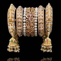 Adorn yourself in magnificence jewelry on your big day since you'll be looking nothing less than a queen! Exuding undeniable glamour, this bangle set features ornate filigree and enriched with beautiful stones for that ultimate sparkle. Gold-plated on high-quality brass as base metal. Made by order. Kindly allow 4-6 weeks for the delivery of this item. For custom or urgent requests, please contact support@alacouture.com. *Please Note: We use faux stones and beads in all of our jewelry. Wedding Filigree Bangle Jewelry, Wedding Filigree Bangle Bracelets, Wedding Filigree Bangle, Regal Diamond Wedding Jewelry, Festive Filigree Bangle, Celebration Round Bangle With Intricate Design, Ornate Hand Set Jewelry For Festive Occasions, Celebration Bangle With Intricate Design, Fusion Style Jeweled Jewelry Sets For Wedding