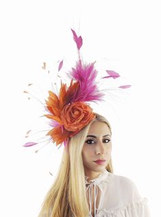 Hats By Cressida Kentucky Derby & Ascot Fascinator Hats Spring Summer Hat & Fascinator Collection A mass of cerise pink and orange feathers surround an orange silk rose Main body about 6-7 inches wide, bigger with the long wispy feathers Mounted with a matching headband. If you prefer a headband to match your hair, please make a note at check out what colour headband you want. We make each hat to order just for you, we would prefer if you did not order for choice. If colour match is important to you please ask for free fabric swatch to be sent to you - this reduces returns and disappointment.   We can also make a custom design for you if you have something else in mind.  Add a touch of elegance to any formal event with the Feather Fascinator! Featuring a stunning design with delicate feath Elegant Hair Accessories For Races And Carnival, Elegant Hair Accessories For Carnival Races, Floral Summer Party Costume Hats And Headpieces, Summer Party Flower Headband, Floral Headpieces For Summer Parties, Elegant Headpieces For Kentucky Derby Costume Party, Elegant Mini Hats For Kentucky Derby Costume Party, Summer Party Flower Headpiece, Orange Headpiece For Kentucky Derby Races