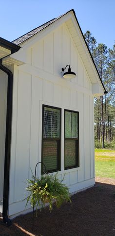 a white house with black trim and windows