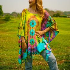 Indulge in the unique charm of our hand-dyed tunic top, meticulously crafted for those who appreciate exceptional fashion. Made from 100% breathable and comfy rayon, this stunning piece is designed to elevate your style while ensuring absolute comfort. Our tunic top stands out with its one-of-a-kind hand-dyed method, guaranteeing that no two pieces are exactly alike. Embracing a loose silhouette, it offers a versatile fit that flatters a wide range of sizes, from S to 2XL. With its side-stitched Spring Festival Kaftan With Natural Dye, Multicolor Kaftan With Natural Dye For The Beach, Hippie Multicolor Tunic For Summer, Hippie Multicolor Poncho For Beach, Summer Festival Multicolor Tunic, Festival Free Size Kaftan With Natural Dye, Multicolor Summer Festival Tunic, Bohemian Tie Dye Kaftan For Summer, Casual Festival Kaftan With Natural Dye