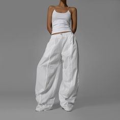 Product details: Waist 66 cm/ 25.98 in Hip 118 cm/  46.46 in Product length 115 cm/ 45.27 in Elastic waist  Wide  One size  Pockets  Lined  100% polyester Oversized Wide Leg Parachute Pants For Spring, Baggy White Parachute Pants For Spring, White Cotton Pants For Spring, White High-waisted Pants, White Casual Straight Cargo Pants, White Casual Parachute Pants For Spring, Casual White Parachute Pants For Spring, Casual White Cargo Pants With Loose Fit, High Waist White Cargo Pants For Spring