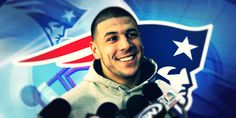 a man is smiling while holding microphones in front of an american flag and the nfl logo