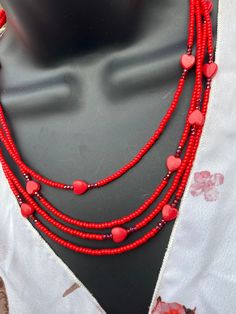 "This beautiful necklace is composed of true red seed beads that surround pretty acrylic hearts  surrounded by faceted glass beads and set asymmetrically among four strands. It is a beautiful piece to add to any outfit and ideal for Valentine's Day. Sterling silver clasp and findings.  Necklace measures approximately 19 3/4\" at shortest strand." Cheap Heart-shaped Beaded Necklaces For Valentine's Day, Affordable Heart-shaped Beaded Necklaces For Valentine's Day, Adjustable Beaded Necklaces With Heart Beads For Valentine's Day, Adjustable Beaded Necklaces For Valentine's Day, Heart Beads Necklace For Valentine's Day, Heart Beads For Valentine's Day Gift, Adjustable Heart Beaded Necklace For Valentine's Day, Valentine's Day Necklaces With Heart And Round Beads, Valentine's Day Necklaces With Colorful Beads