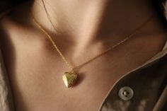 Wear your heart on your sleeve (or your neck) with our Love Locket Necklace. Made with durable, gold filled material, this necklace is perfect for everyday wear. Show your support for love in all forms with our love is love necklace. Material Information: If you need a chain of a specific, shorter length than what is available, please feel free to request it—we can customize the chain to any size to guarantee a perfect fit. When placing your order, choose the nearest longer chain length availabl Everyday Gold Plated Heart Necklace, Gold Heart Pendant Necklace For Everyday, Everyday Locket Pendant Charm Necklace, Everyday Heart Locket Necklace For Valentine's, Dainty Locket Necklace For Everyday, Dainty Everyday Locket Necklace, Everyday Gold Locket Necklace With Adjustable Chain, Everyday Gold Heart Necklace With Adjustable Chain, Dainty Adjustable Locket Necklace For Anniversary