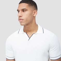 Crafted from soft cotton blend, this honeycomb stitch short-sleeved polo offers an impeccable balance of comfort, softness, breathability, and durability. It features a sleek Johnny collar and distinct contrast-tipped V-placket, collar, armbands, and hem for a modern touch, while the short sleeves offer versatility for layering or wearing solo on sunnier days. White Short Sleeve Polo Shirt With Ribbed Collar, Fitted Golf Tops With Ribbed Collar, Fitted Tops With Ribbed Collar For Golf, Short Sleeve Cotton Polo Shirt With Textured Knit, Short Sleeve Cotton Textured Knit Polo Shirt, White Collared Top With Seamless Collar, Fitted Textured Knit Collared Polo Shirt, White Textured Knit Collared Top, White Fitted V-neck Polo Shirt