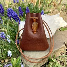 "Vegan Eco Leather Medicine Bag, Shaman Bag or Amulet Pouch to wear around your neck-or hang in your Car! A place for things that have Spiritual Meaning for you-your Sage,Crystals,or that pretty rock your 3 year old gave you.... 3 3/4\"deep 2 3/4\"wide Choice of 2 colors:- - -Black /Double Terminated Labradorite Crystal Point -Russet Brown/Red Agate and Baltic Amber Stones Please note these are natural Gemstones- each one is completely different...like snowflakes! BUY ANY 4 MEDICINE BAGS(VEGAN L Portable Brown Coin Purse For Gift, Brown Coin Purse For Gifts, Brown Portable Coin Purse For Gift, Brown Portable Pouch For Gift, Small Brown Bag For Gift, Small Brown Gift Bag, Diy Medicine Pouch Necklace, Diy Leather Medicine Pouch, Native Medicine Bags