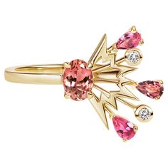 Handcrafted in London in 18 Carat Yellow Gold with a Central Oval Cherry Coloured Tourmaline, surrounded by Brilliant Cut Diamonds, and Pear Shaped Pink Sapphires and Tourmaline. Cherry Bomb Ring is a unique, modern and layered design, that combines the graphics of pop art with the natural explosion of a firework through the air. It is statement ring, for those of you who love colour. For variations in stone colour and metal, please email to discuss commissioning a bespoke version. MATERIALS 18K Resort Jewelry, Bold Statement Jewelry, Diamond Cocktail Ring, Stone Colour, Diamond Cocktail Rings, Cherry Bomb, Layered Design, Summer Jewelry, Cocktail Ring