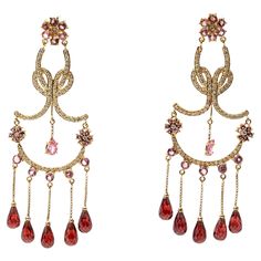 Striking 14K Gold, Pink Tourmaline, Diamond And Garnet Chandelier Earrings. A truly unique pair of chandelier earrings that is sure to make a striking statement. These earrings are crafted of 14K yellow gold and set with round cut pink tourmalines. Diamonds frame the tourmalines and accent the earring creating a brilliant shimmer. Suspended from the base of the earrings are briolette cut garnets with a deep burgundy color. Tourmalines are approximately 3.2 TCW and the diamonds are approximately 1.5 TCW. Post with clutch style backings, clutches are not included. Marks: Unmarked, tested as 14K Dimensions: 3 3/16" L x 1 1/4" W Weight: 14.4 Gross dwt Pink Chandelier Earrings, Chain Jewelry Ideas, Pink Chandelier, Jewelry Instagram, May Weddings, Deep Burgundy, Lorde, Chain Jewelry, Burgundy Color