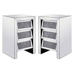 two mirrored side tables with drawers on each side and one drawer open to show the same item