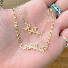 "This unique personalized single name cut-out necklace is composed of 14K solid gold and beautifully complemented by a durable 14K solid gold adjustable chain. This design is also available to be purchased as a charm alone without the chain. NOTE: Kindly indicate the language desired (i.e. Hebrew, Farsi, or Arabic) in the \"Notes\" section upon checkout. ♦Name Dimensions: approximately 7mm high x width depending on the names desired ♦ Pendant Thickness: approximately 1mm ♦ Metal Finish: High Shi Custom Engraved Gold Plated Nameplate Necklace, Customized 14k Yellow Gold Necklace, Gold Plated Custom Nameplate Necklace, Custom Name Gold Plated Nameplate Necklace, Rose Gold Engraved Name Necklace In Gold Plated, Rose Gold Plated Nameplate Necklace, Adjustable Chain Nameplate Necklace, Rose Gold Nameplate Necklace, Gold Plated, Customized Yellow Gold Nameplate Necklace