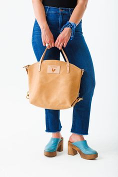 Your bag is proudly made in Lynchburg, Virginia using the finest materials in the world. H 12" (top of curve) x W 5" x 15" Top Length 4.5 ” tote handle drop Made with all natural, vegetable tanned Virginia leather* Includes removable/adjustable 1" leather backpack straps and a removable/adjustable leather crossbody strap that extends from 36" to 43" Straps are bench made with Vachetta leather** and solid brass hardware Interior hanging pocket and key clip Lined with the acclaimed Liberty of Lond Lynchburg Virginia, Convertible Backpack, Key Clip, Dark Denim Jeans, On The Farm, Leather Cleaning, Backpack Straps, The Farm, Vegetable Tanned Leather